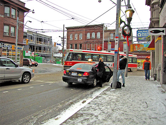 taxi, cabbagetown, streetcard, carlton street, parliament street, intersection, snow, ice, winter, road, toronto, city, life