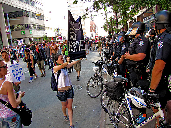 g20, protests, protesters, placards, signs, message, college street, police headquarters, toronto, city, life