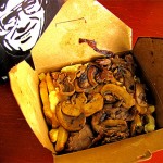Random image: layer: fries, layer: curds, layer: sliced beef, layer: onions, layer: mushrooms, layer:gravy, layer: gravy, layer: gravy